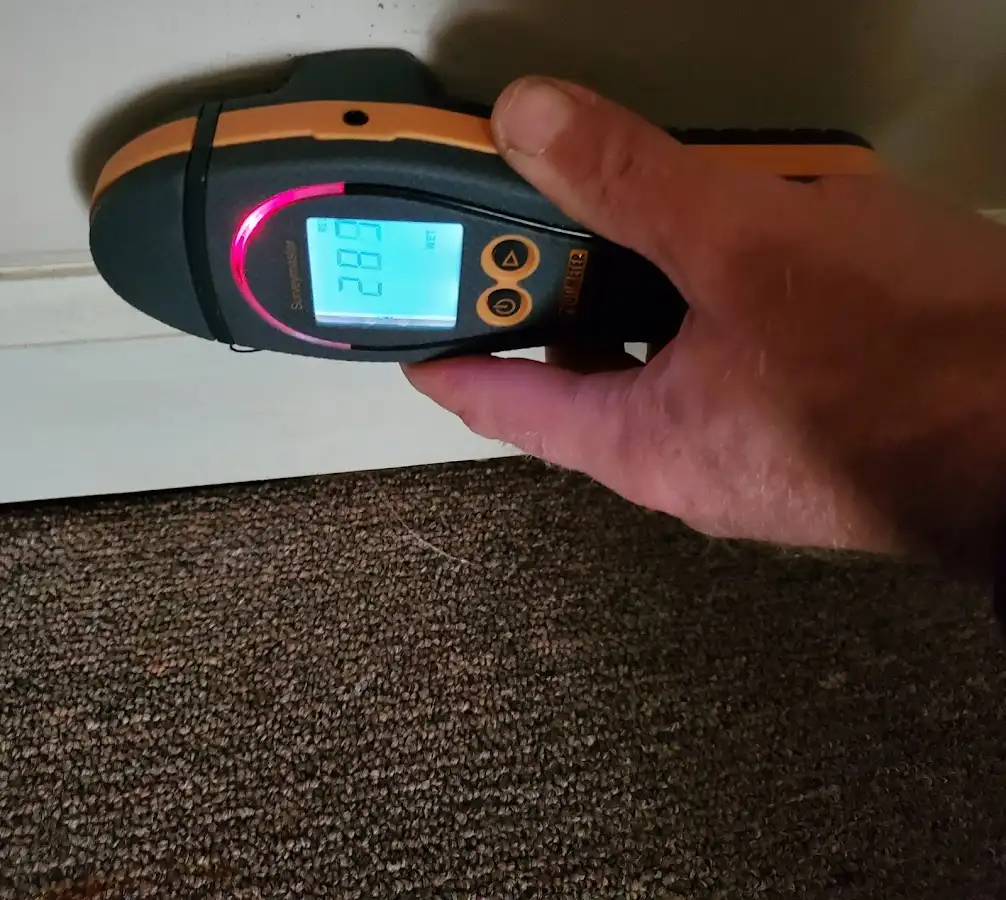 Moisture detection at baseboard during Storm Damage Restoration in Apple Valley
